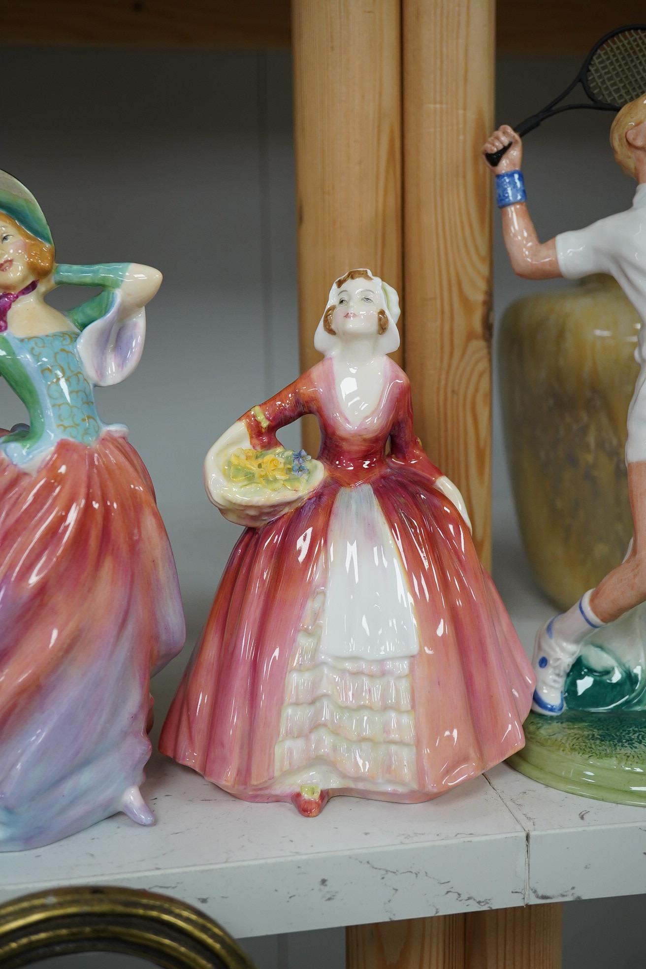 Four Royal Doulton figures to include The Ace HN 3398, Autumn Breezes HN 1911, Janet HN 1537 and The Old Balloon Seller HN 1315. Condition - good